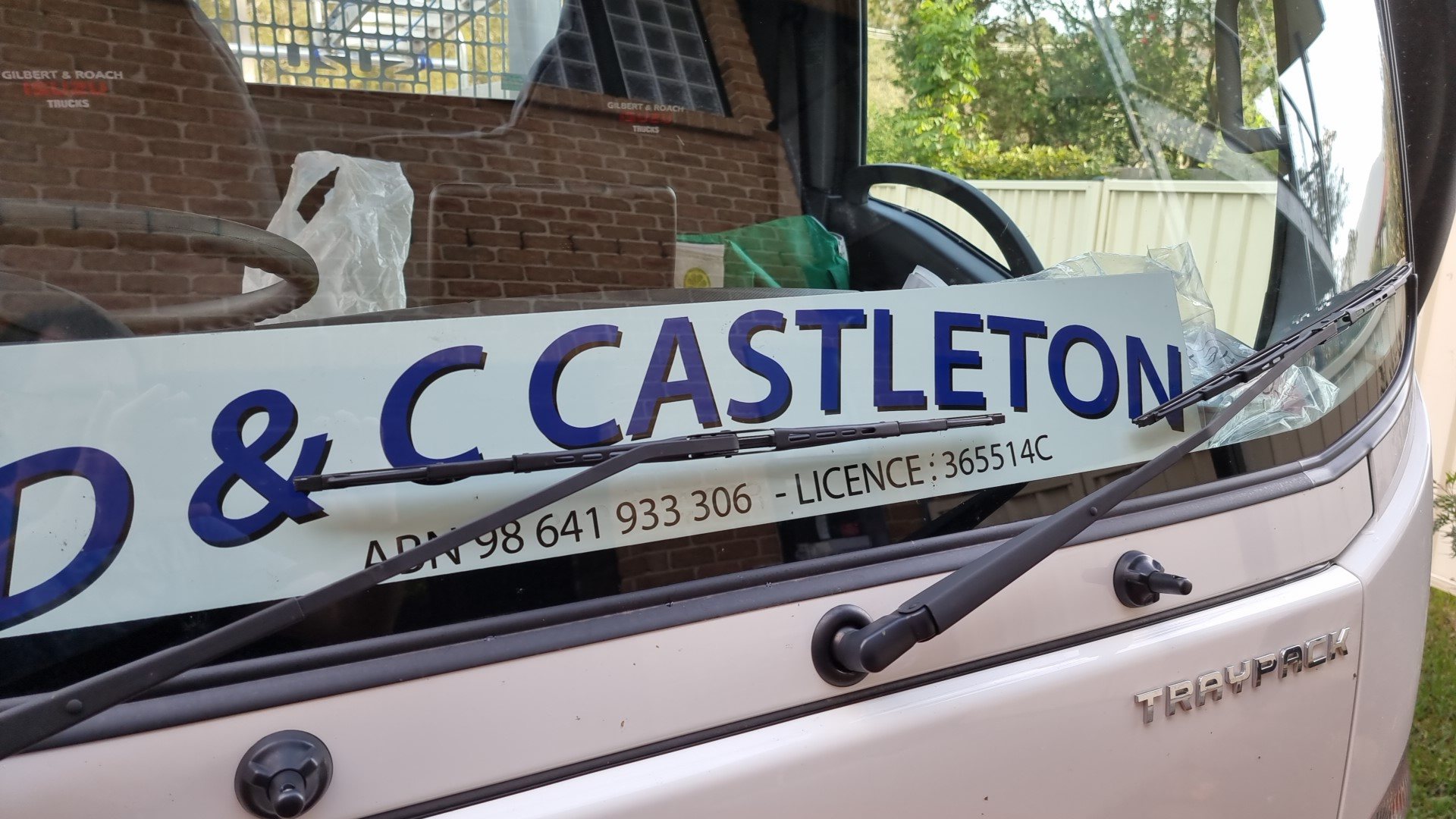 The D & C Castleton sign on the truck windscreen, showing ABN 98 641 933 306 and licence 365514C